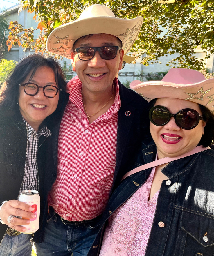 three people dressed in western gear