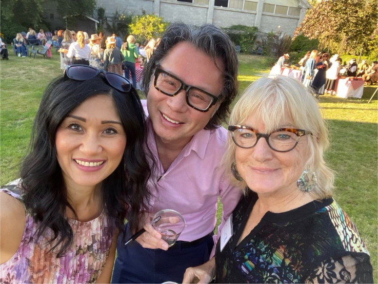 fred lee smiling with two women