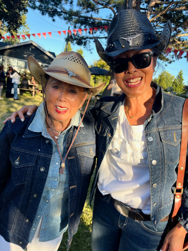 two people in cowboy hats smiling