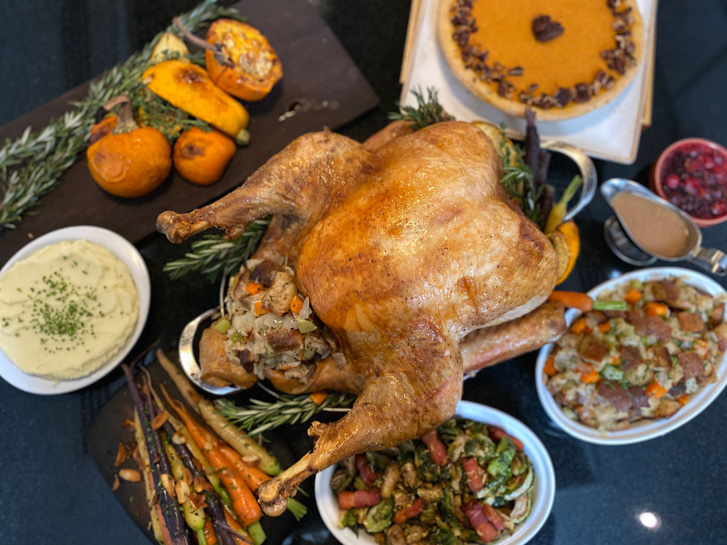 Roast turkey with stuffing and vegetables and a pie