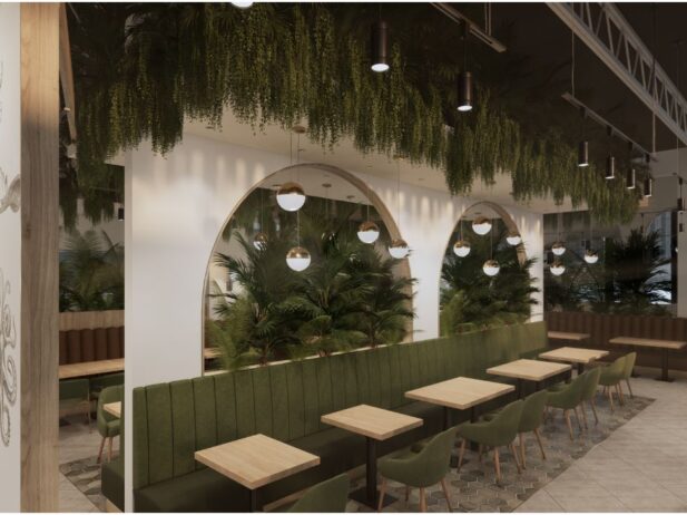 tables along a greenery lined wall