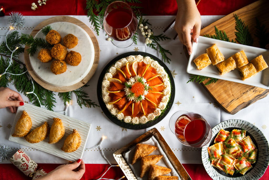 A table filled with fish-based appetizers and dishes on plates. 