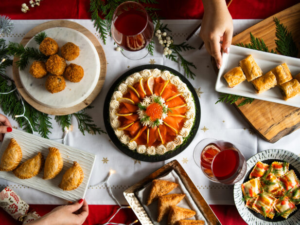 A table filled with fish-based appetizers and dishes on plates.