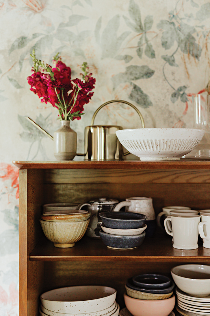 ceramics displayed on a teak buffet