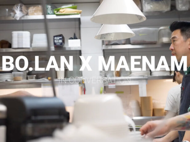 maenam chef angus an and the chef of bo.lan look at each other across a busy kitchen in a screenshot from a video