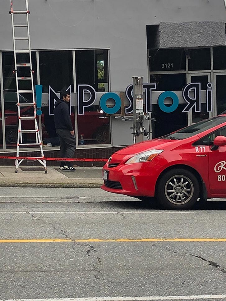 The Impostori sign during installment. 