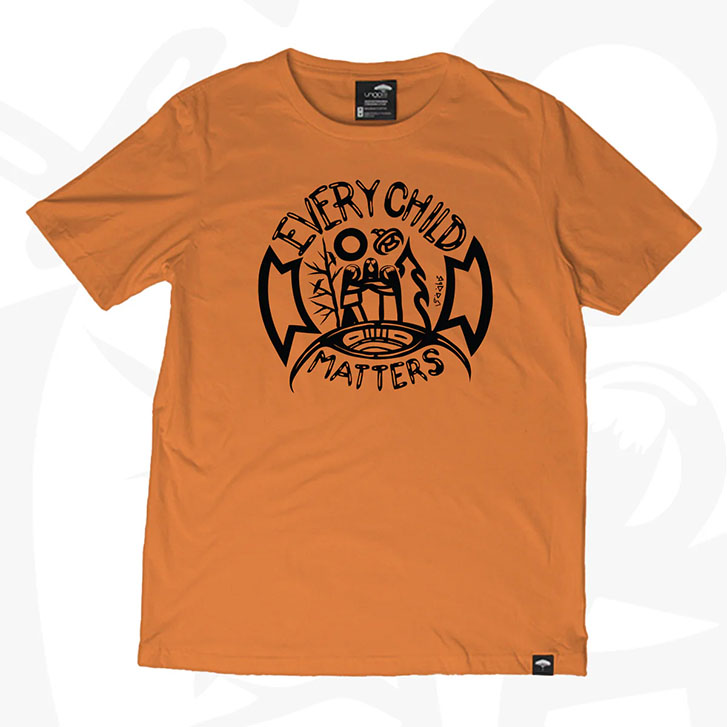 Black, circular design of three people in nature on an orange shirt.