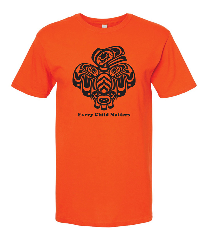 Orange shirt with a black design of a Raven mother with wings outstretched in the shape of a heart, protecting her two babies.