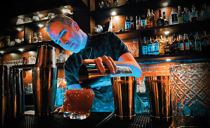man mixing cocktails