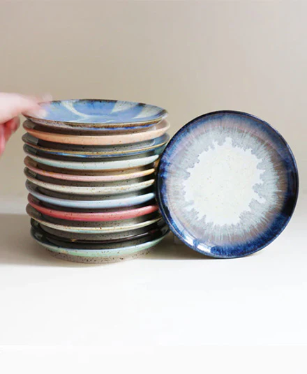 stack of ceramic plates with different designs